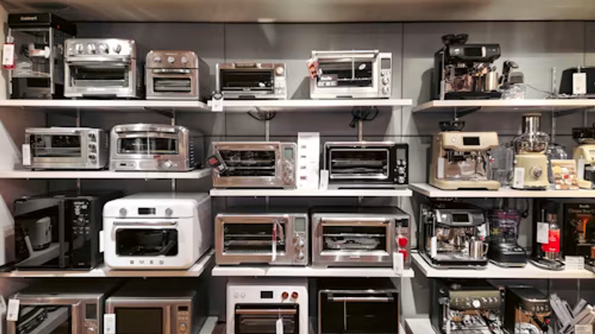 person reheating dinner countertop oven in an everyday setting